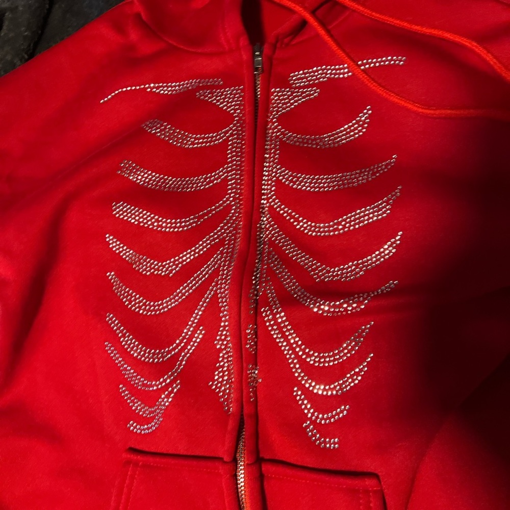 Red sweatshirt skeleton design with rhinestones